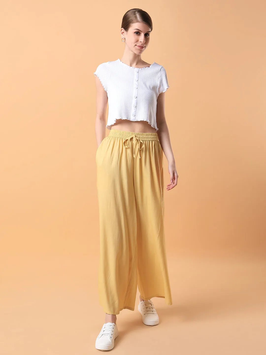 Women Yellow Solid Pleated Loose Fit Palazzos