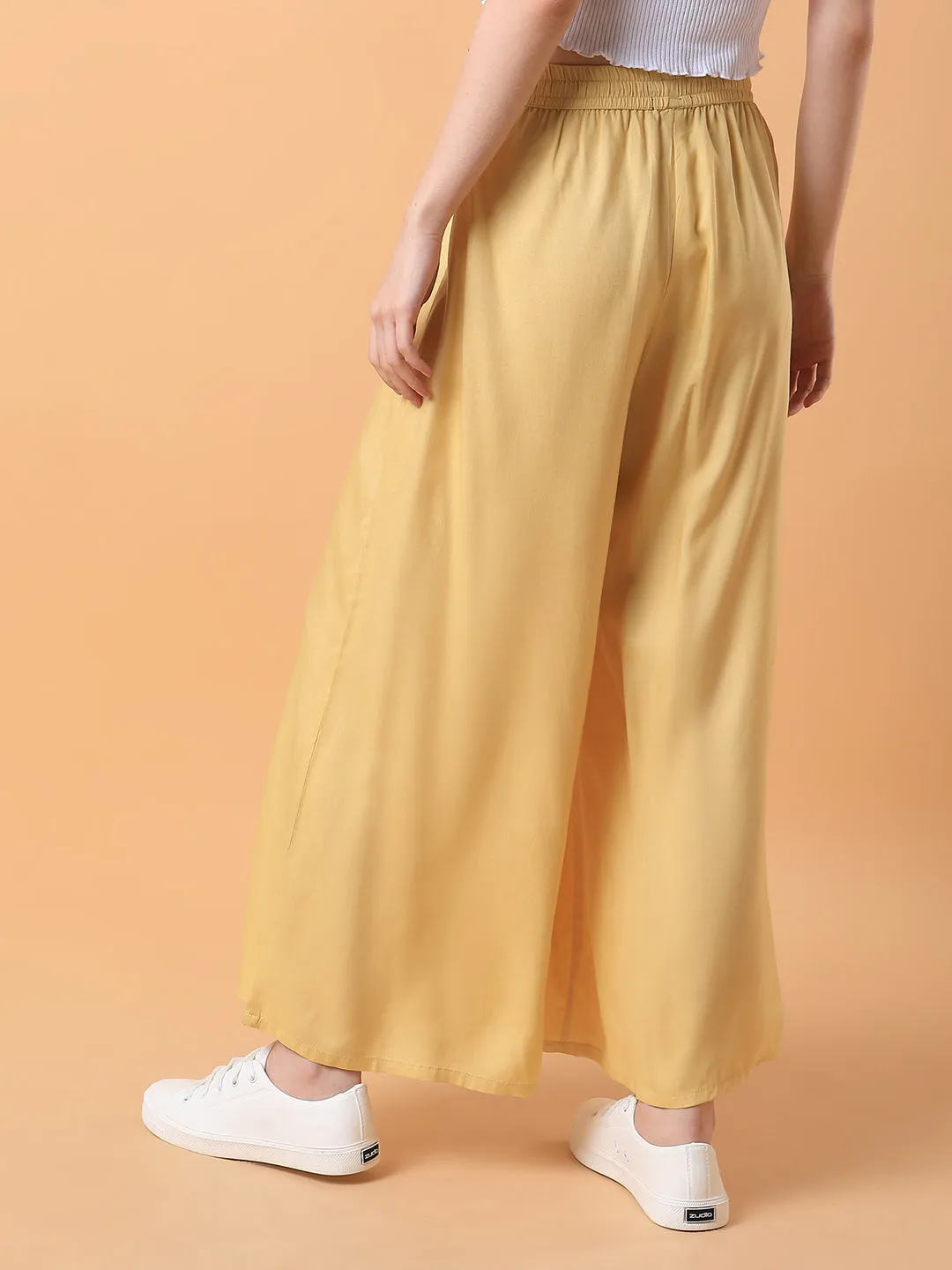 Women Yellow Solid Pleated Loose Fit Palazzos