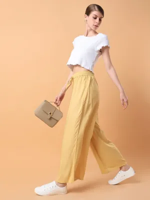 Women Yellow Solid Pleated Loose Fit Palazzos